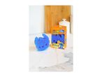 Blue character-shaped sponge and its packaging, featuring a cartoon character.