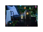 LIVARNO home LED Solar Lanterns on a patio table with a drink and garden chair.