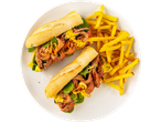 Two beef minute steak sandwiches with fries on a white plate.