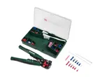 A crimping tool and a case filled with various electrical connectors and cable ties.