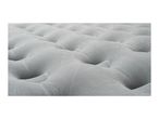 Close-up of a grey inflatable sleeping mat with a textured, wavy surface