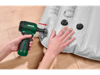 Person using a Parkside 12V cordless mini blower to inflate a Rocktrail air mattress.