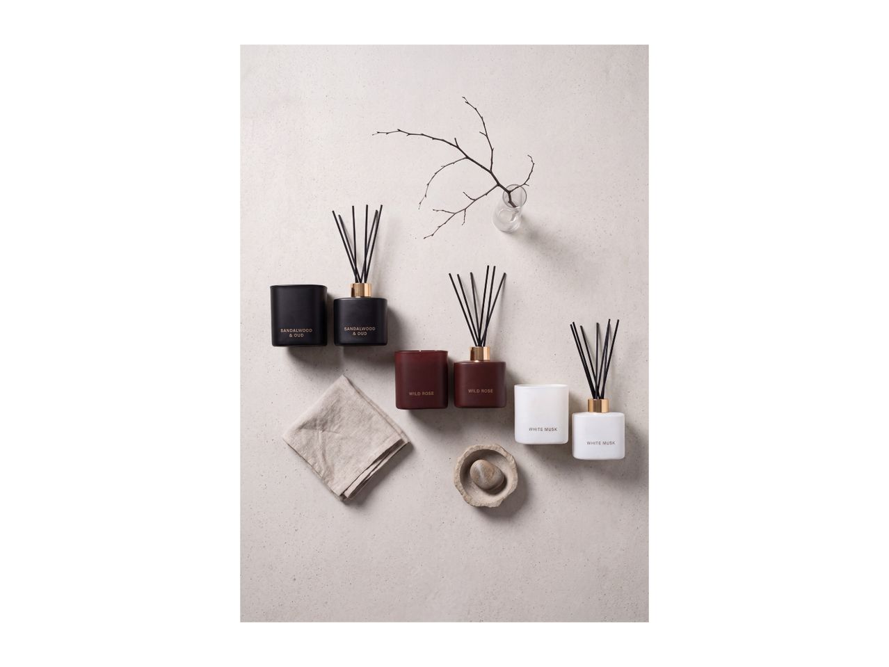 Scented candles and reed diffusers in Sandalwood & Oud, Wild Rose and White Musk.