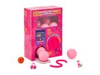 Pink Vending Machine Surprise toy with capsules and small toys like a flamingo and a ball.