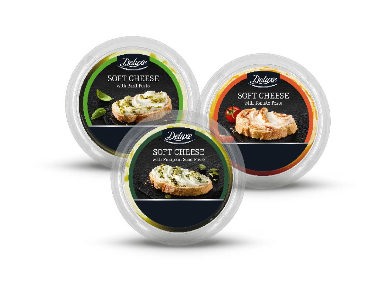 Tri pakiranja Deluxe mekog sira s različitim okusima: bosiljak, sjemenke bundeve i rajčica.
