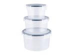 A stack of three clear plastic food storage containers with blue lids.