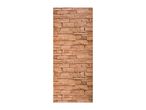 A vertical section of a brown stone wall with various sized rectangular blocks.