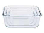 Set of three clear glass food storage containers, nested inside each other.