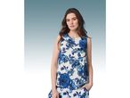Woman modeling a sleeveless blue and white floral blouse and matching pants.