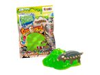 A green, dinosaur-shaped, jelly shoe toy in packaging.