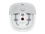 White foot spa with a control dial, massage rollers, and a red light, viewed from above.