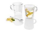 Two double-walled glass mugs with handles, one filled with lemon slices and water, plus a spoon.