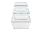 A stack of four clear glass food storage containers with light blue lids.