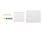 A craft kit with paints, brushes, a bag of plaster, and a mold tray with various shapes.
