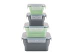 Stack of four collapsible silicone food storage containers with clear lids