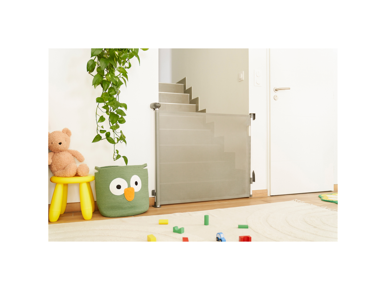 Badabulle Safe retractable baby gate at the bottom of stairs