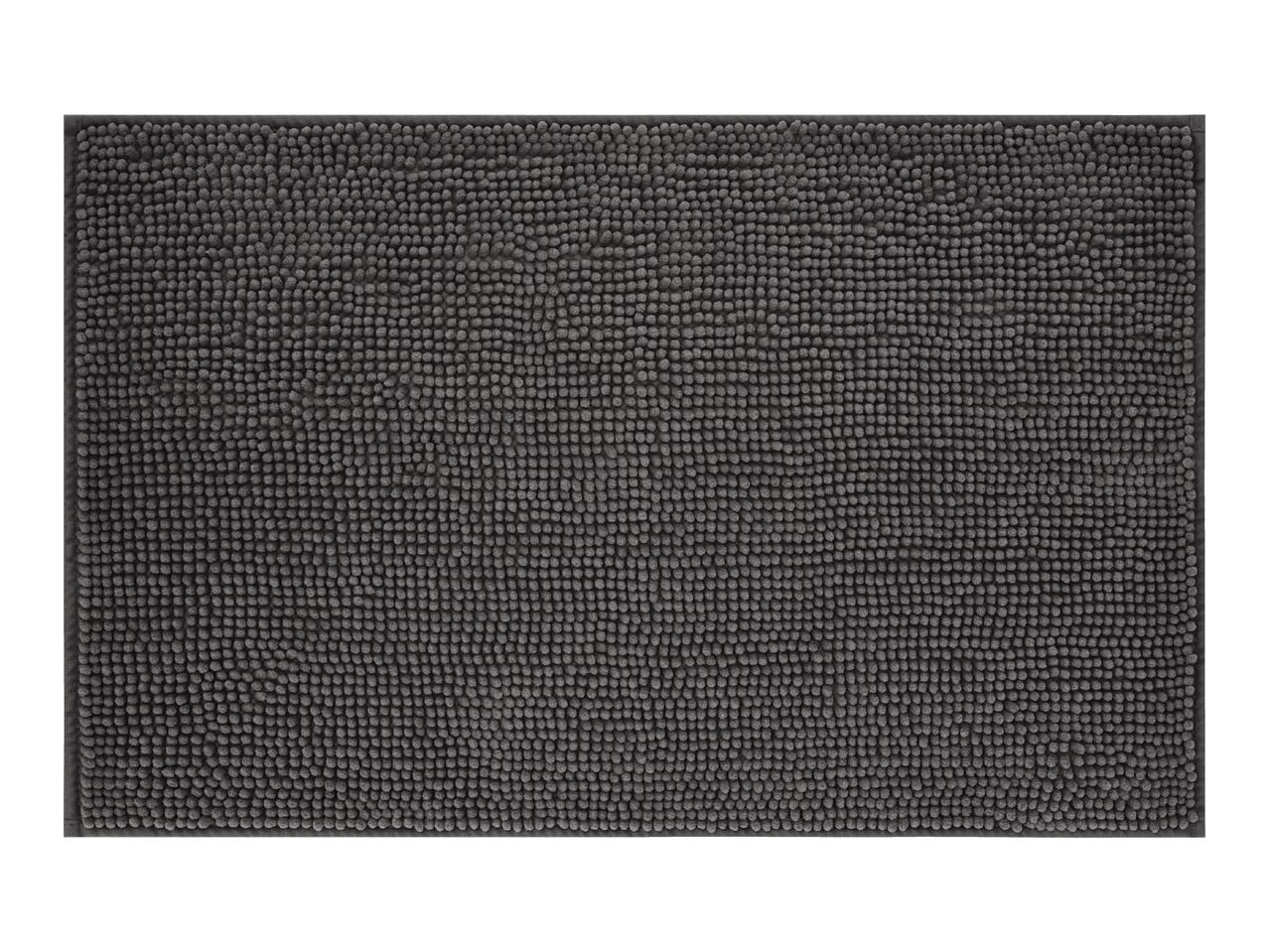 Dark grey bath mat with a textured, bobble surface.