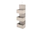 Beige woven fabric hanging organizer with three shelves.