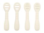 Four cream-colored baby teethers with textured surfaces and handles, two with open slots and two with raised bumps.