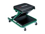 Green and black foldable workshop creeper seat with wheels, angled view.