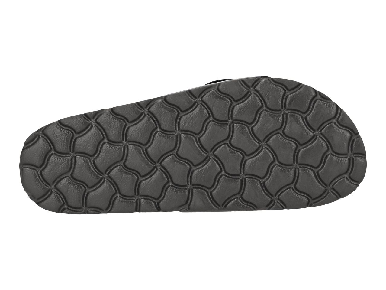 Bottom view of a dark grey sandal sole with a textured, wavy pattern.