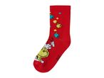 Red Christmas sock with a Grinch character and colorful ornaments.