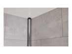 Close-up of a black shower rod installed in a corner, against grey tiles.