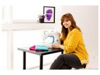 Singer M3205 sewing machine, fabrics, and seamstress.
