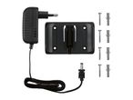 Power adapter with cable, wall mount, and four screws with wall plugs.
