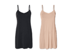 Zwei schulterfreie Unterkleider, eines schwarz, eines beige, auf schwarzem Hintergrund.