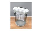 TRONIC paper shredder on a mesh waste bin, shredding paper strips