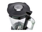 Close-up of a blender with a black lid and a clear measuring cup.