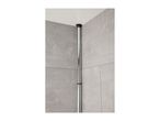 A corner shower rod is installed in a tiled bathroom.
