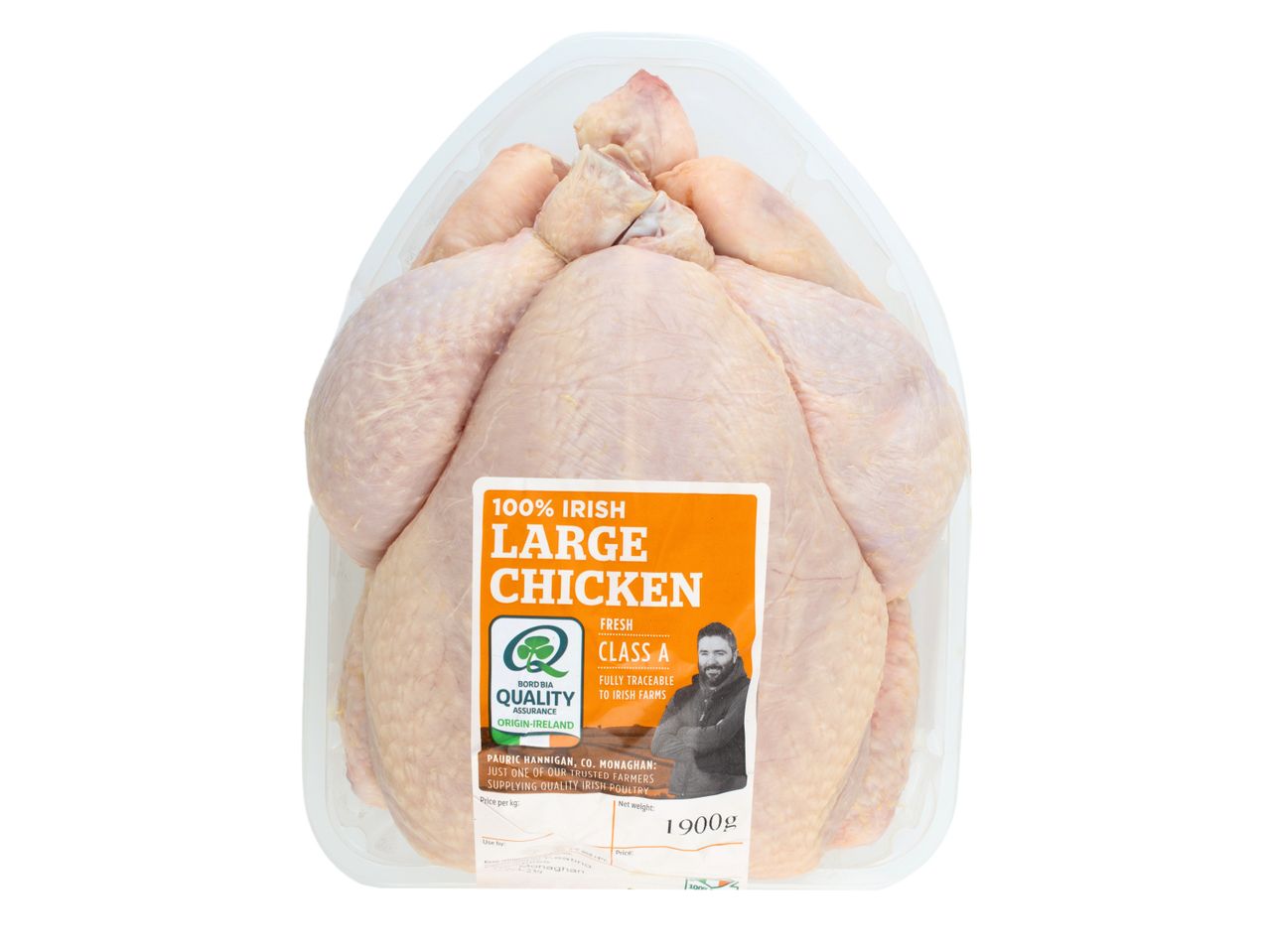 A whole, large, fresh chicken in plastic packaging.