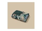 Quilted blanket with a tropical leaf pattern in shades of green, brown, and pink.