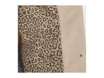 A close-up of a beige coat with a leopard print lining.