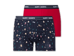Zwei Boxershorts: eine rote und eine dunkelblaue mit Weihnachtsmotiven.