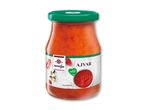 Glas med mild ajvar, en rød peberbaseret relish, med en grøn låg og hvid etiket.