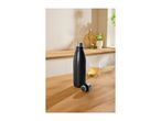 Black insulated stainless steel bottle with its cap off on a wooden table