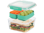 Sistema lunch box with sandwich, carrots, and grapes.