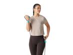 Woman in beige Crivit® sports top and dark leggings, holding a jump rope.
