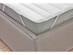 Beige mattress topper and bed base.