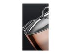 Close-up of a copper pot with a stainless steel lid and handle