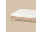 Livarno Jersey Fitted Sheet with a strawberry pattern on a wooden bed frame.