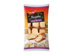Packaging for sponge cake bites, with a rustic wooden background and sun patterns.