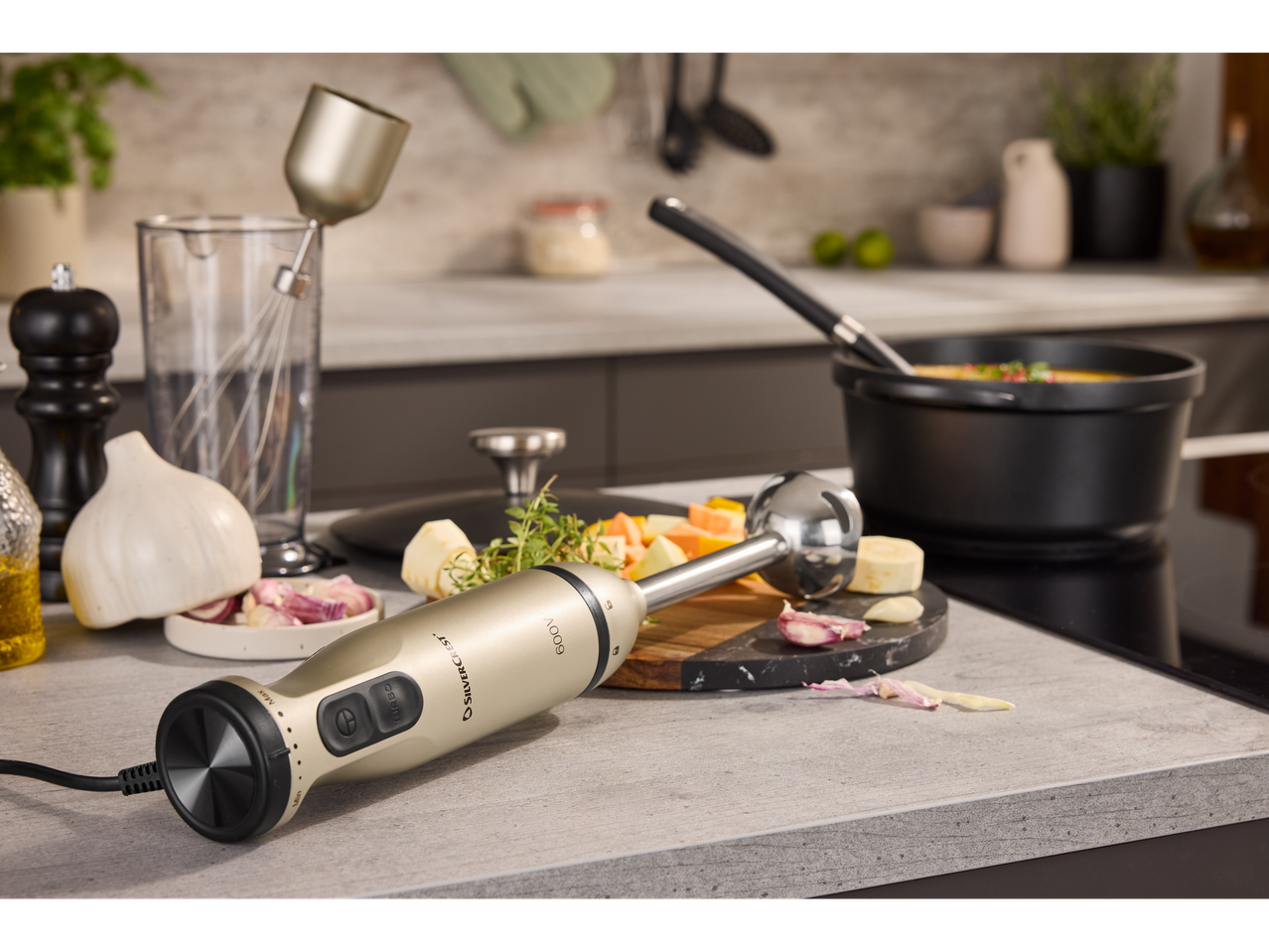 SILVERCREST® hand blender set with ingredients for soup on a kitchen counter.