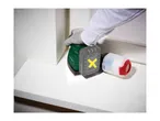 A person using a cordless multi-sander on a white wooden surface.