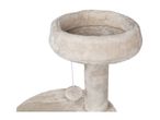 Beige cat tree with a round bed on top and a dangling pom-pom toy.