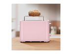 Pink toaster with a bread roll on top, on a wooden counter.