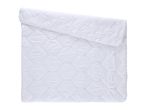 White quilted duvet, partially folded, on a white background.